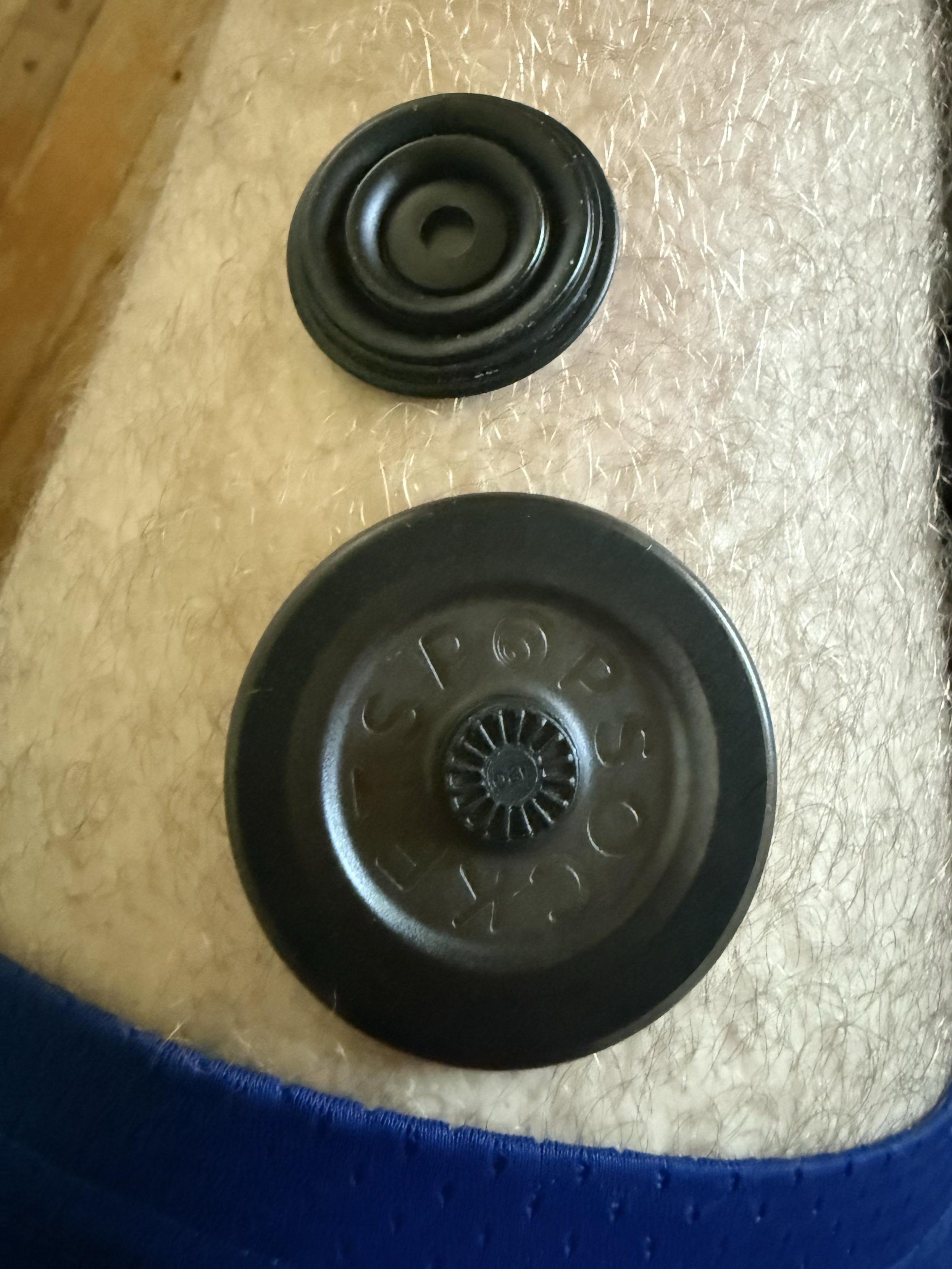 A broken MagSafe pop socket